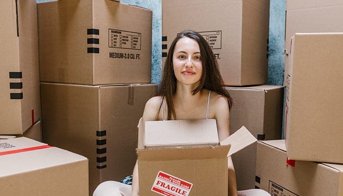 woman sitting boxes